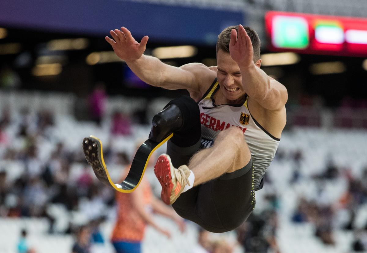 a male Para athlete mid long jump