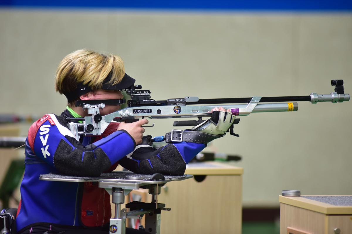 a female Para shooter taking a shot