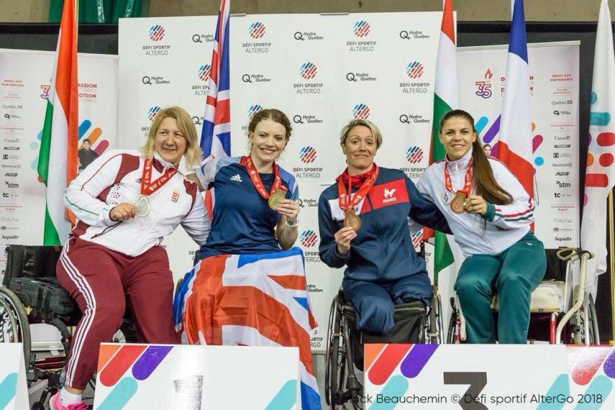 Gemma Collis-McCann a group of female wheelchair fencers in a row
