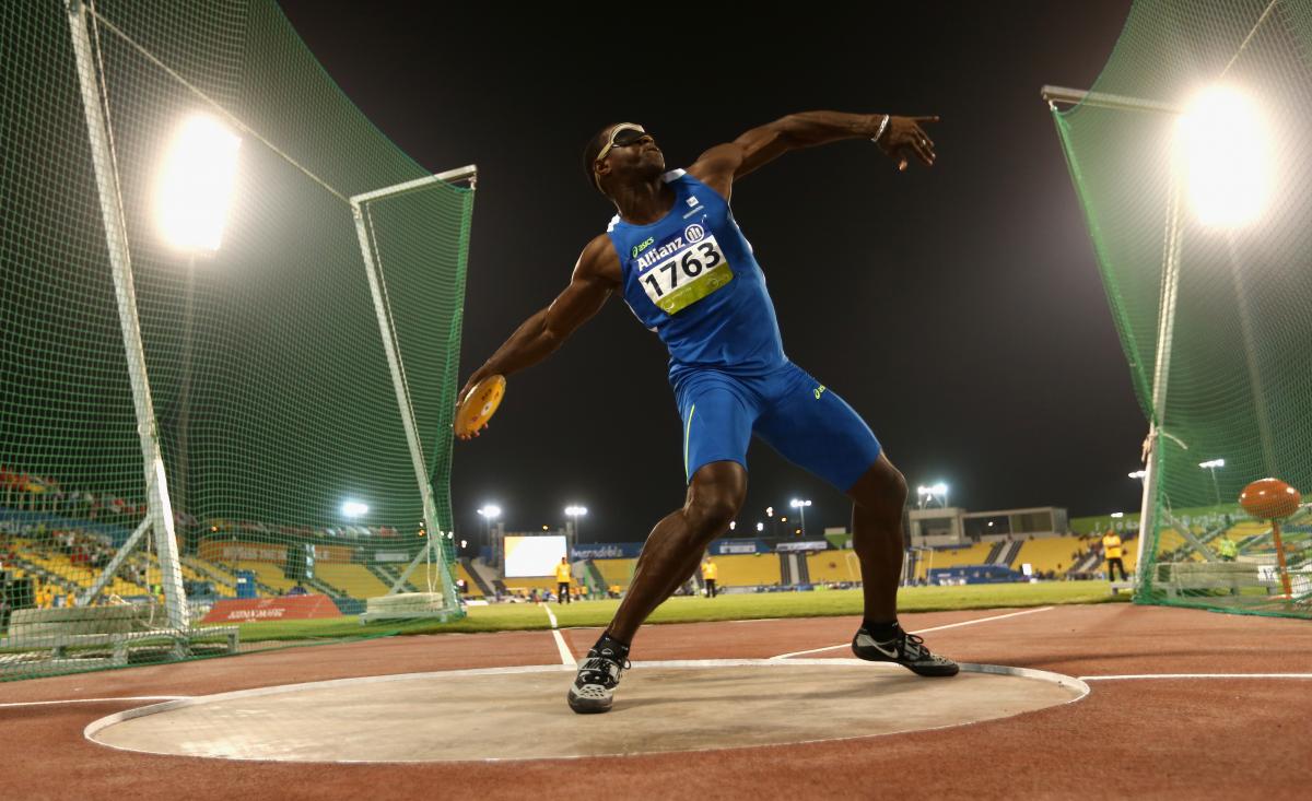 a male discus thrower in action