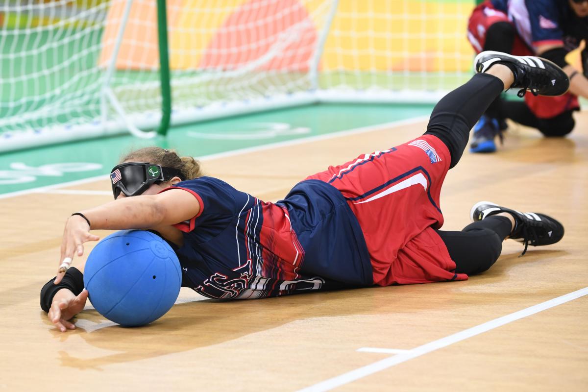 Amanda Dennis a female goalball player saves a shot