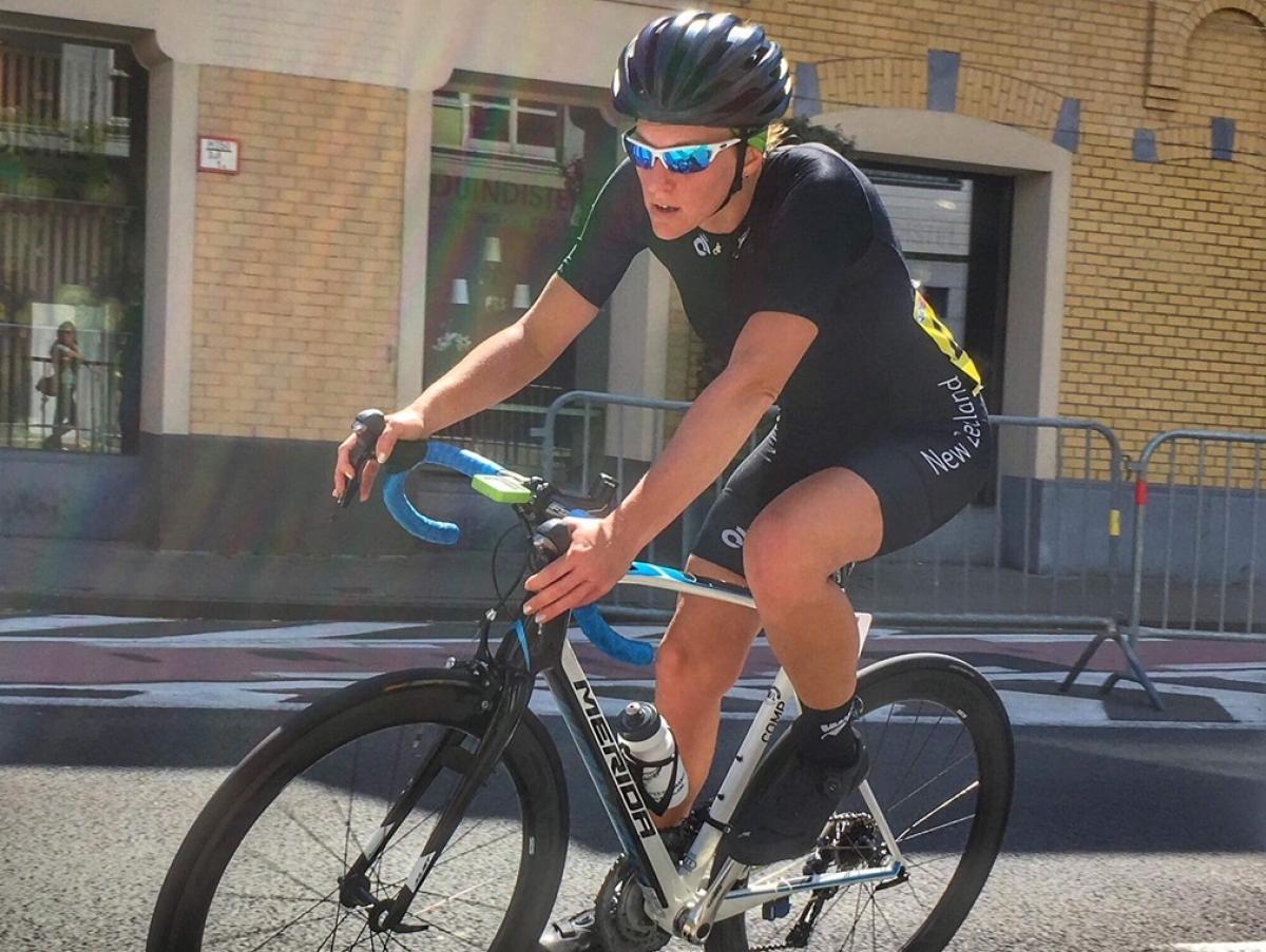 Sarah Ellington - New Zealand cycling a female Para cyclist comes round a road bend