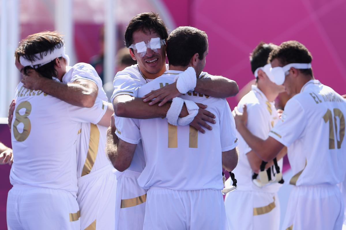 Spain blind football team a group of blind footballers hugging eachother