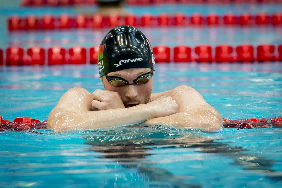 Male swimmer in goggles in the pool