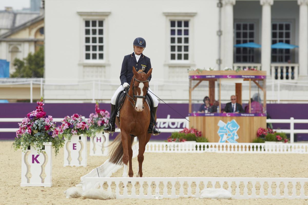 Hannelore Brenner a female Para equestrian rider on her horse performing dressage