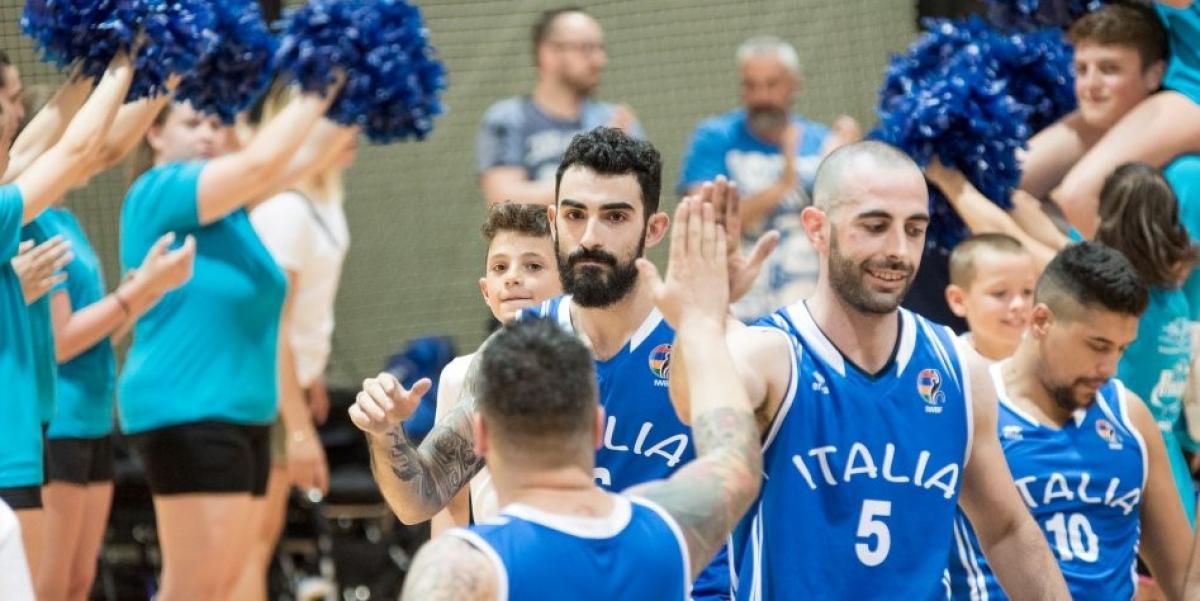 Italy men's wheelchair basketball a group of male wheelchair basketballers on court