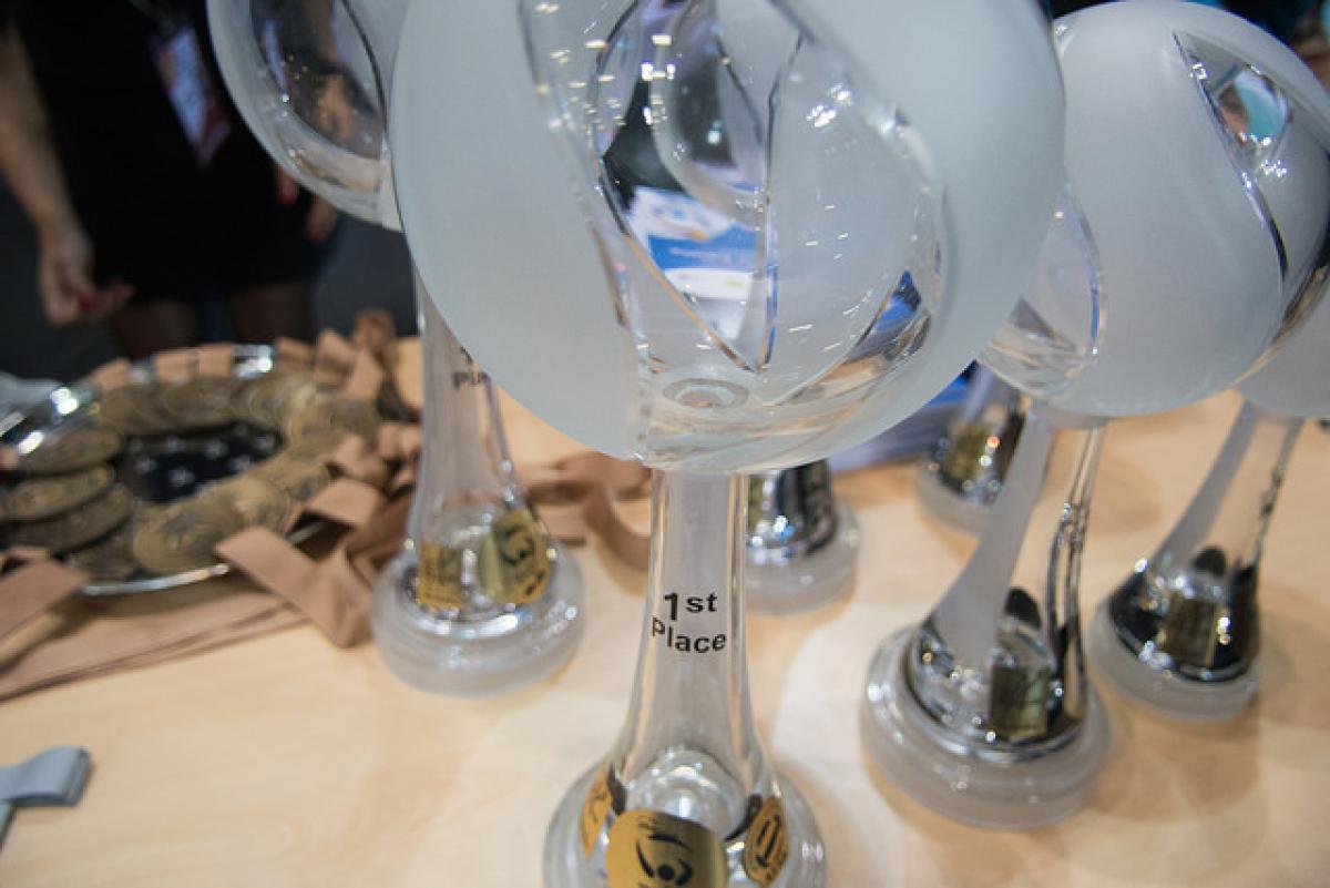Glass-looking trophies for sitting volleyball World Championships medallists