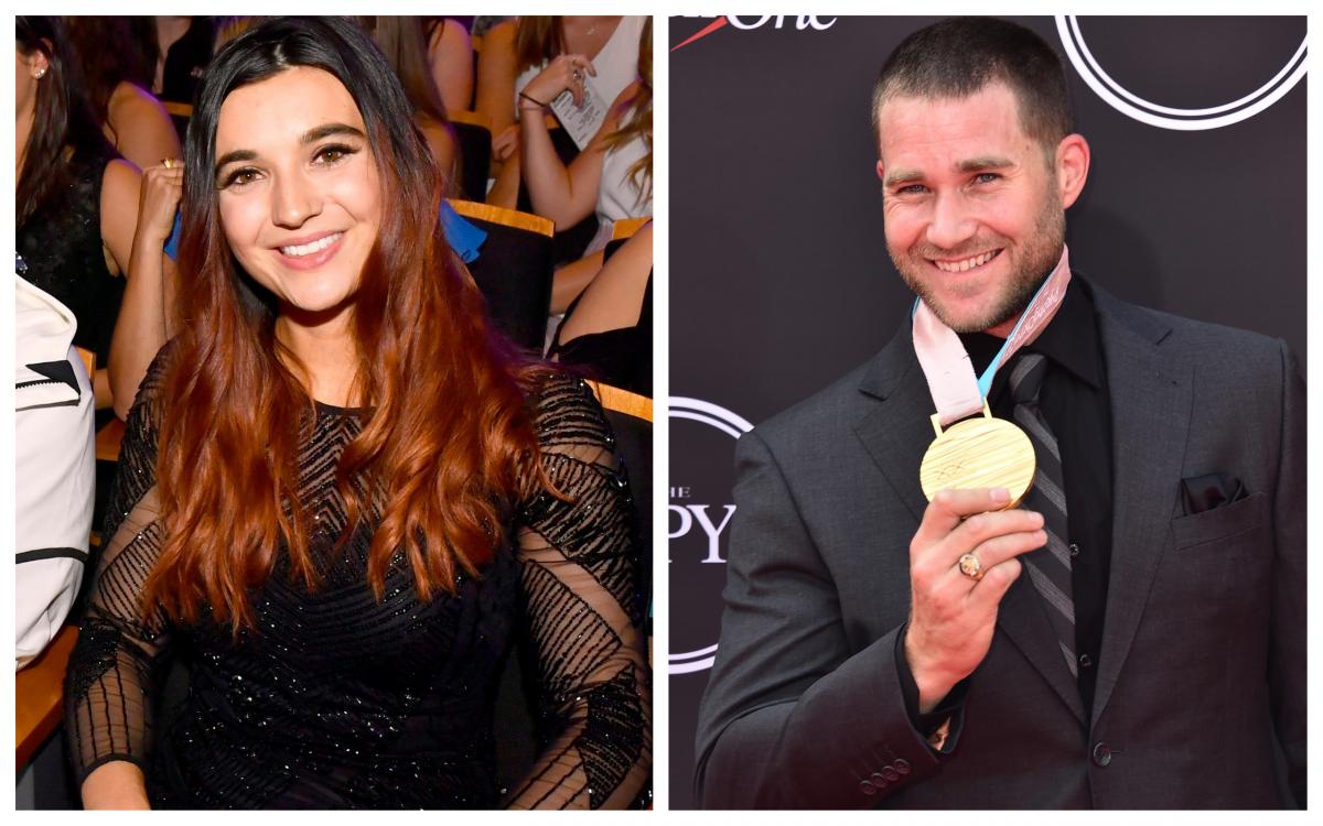 Female Para snowboarder Brenna Huckaby and male Para snowboarder Mike Schultz at an awards ceremony