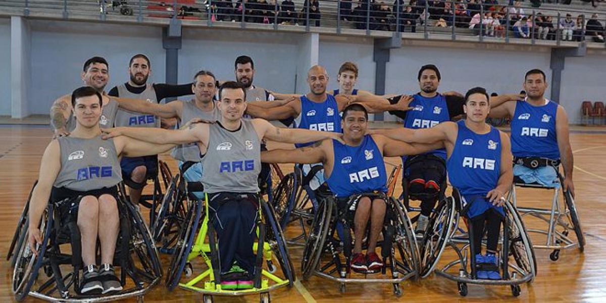 a group of Argentinian male wheelchair basketballers pose on a court