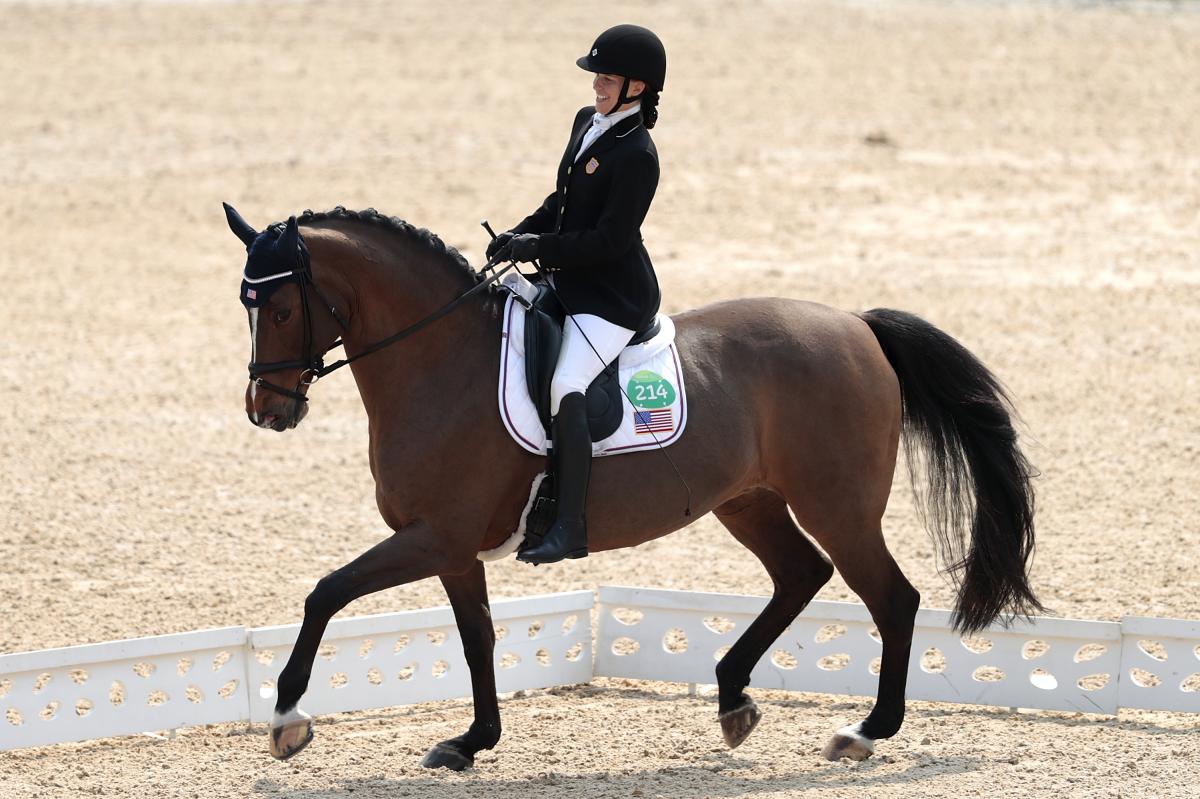Rebecca Hart - Rio 2016 female Para equestrian rider Rebecca Hart competes on a horse in a dressage arena