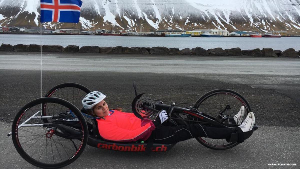 female Para cyclist Arna Albertsdottir in action on the road