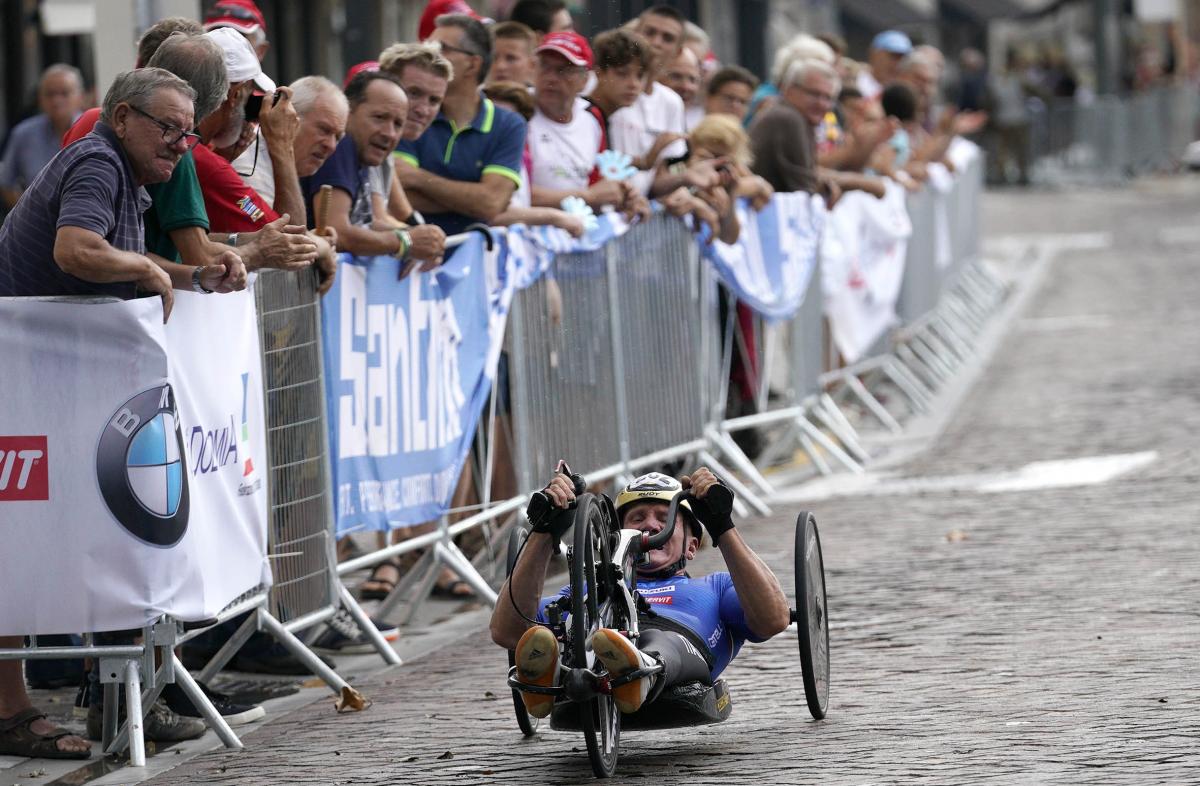 male Para cyclist Fabrizio Cornegliani riding a handbike on a road