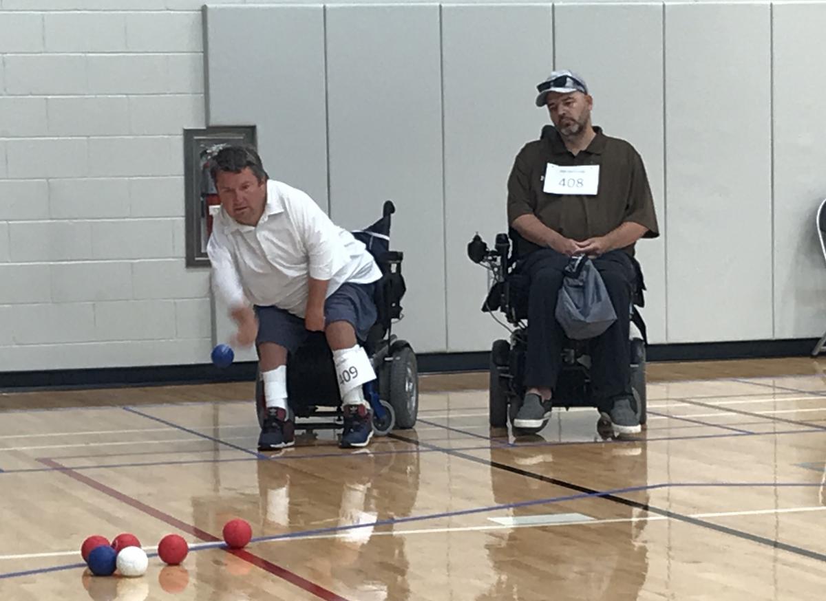 male boccia player Nick Taylor takes a throw