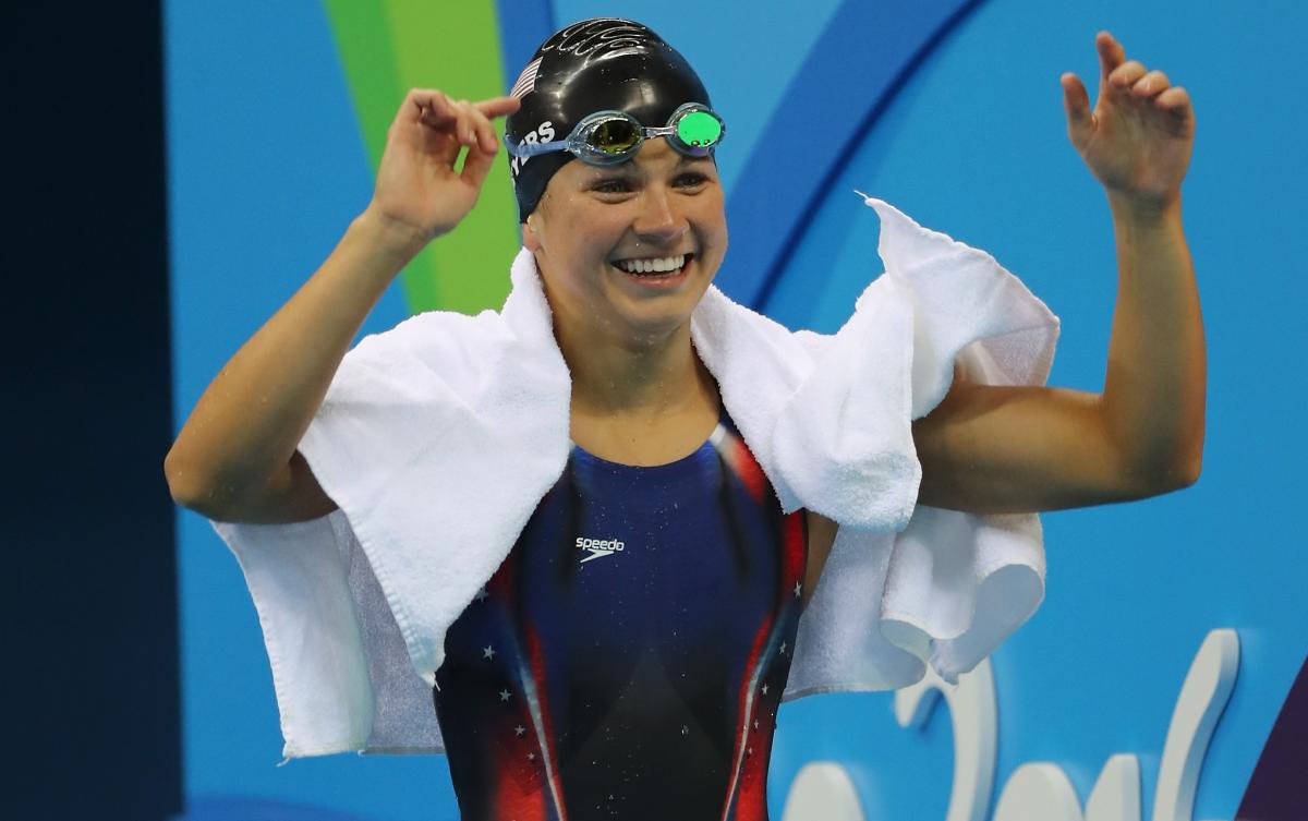 female Para swimmer Rebecca Meyers celebrates after getting out of the pool