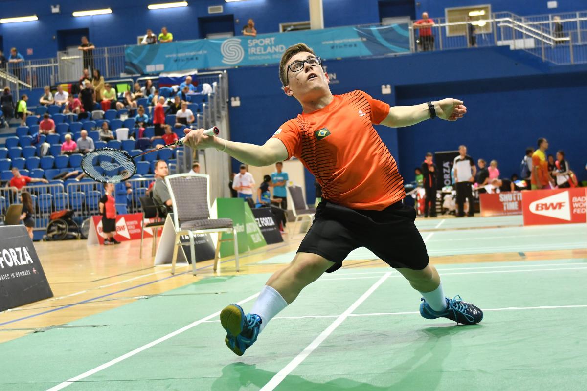 male Para badminton player Vitor Goncalves Tavares plays a forehand