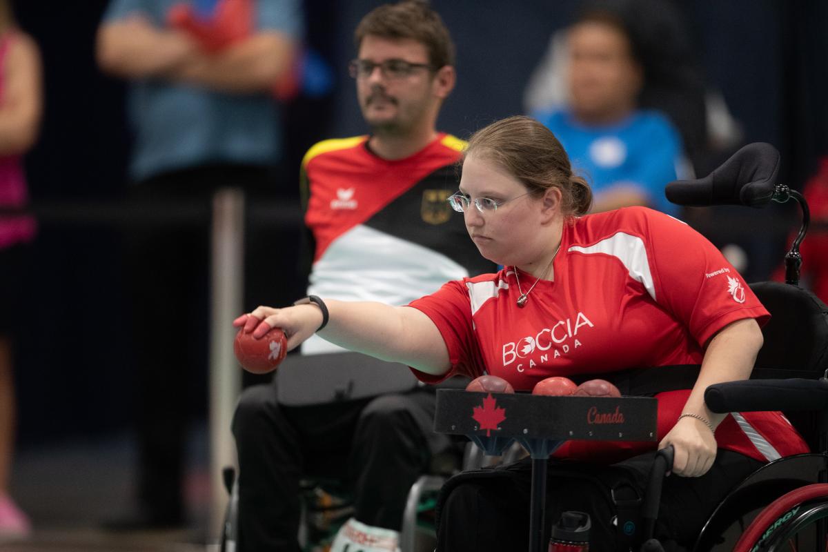 female boccia player Alison Levine takes a shot