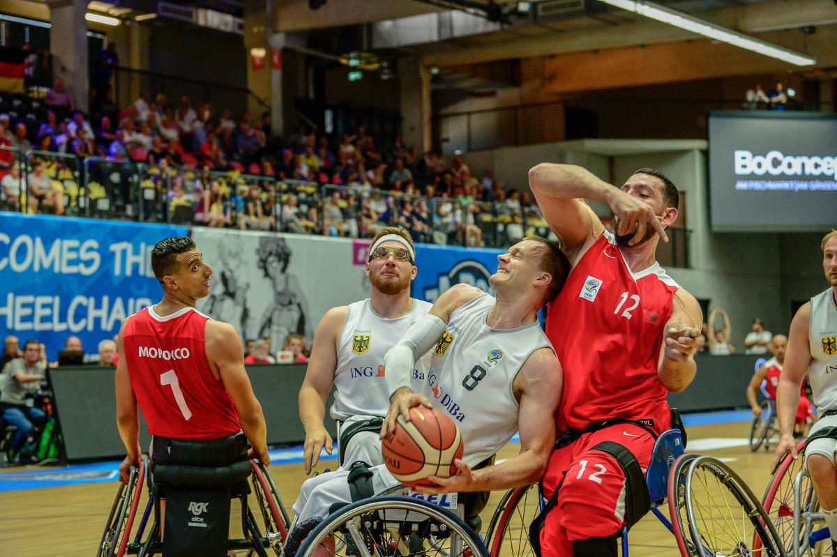 male wheelchair basketballer Andre Bienek holds on to the ball 