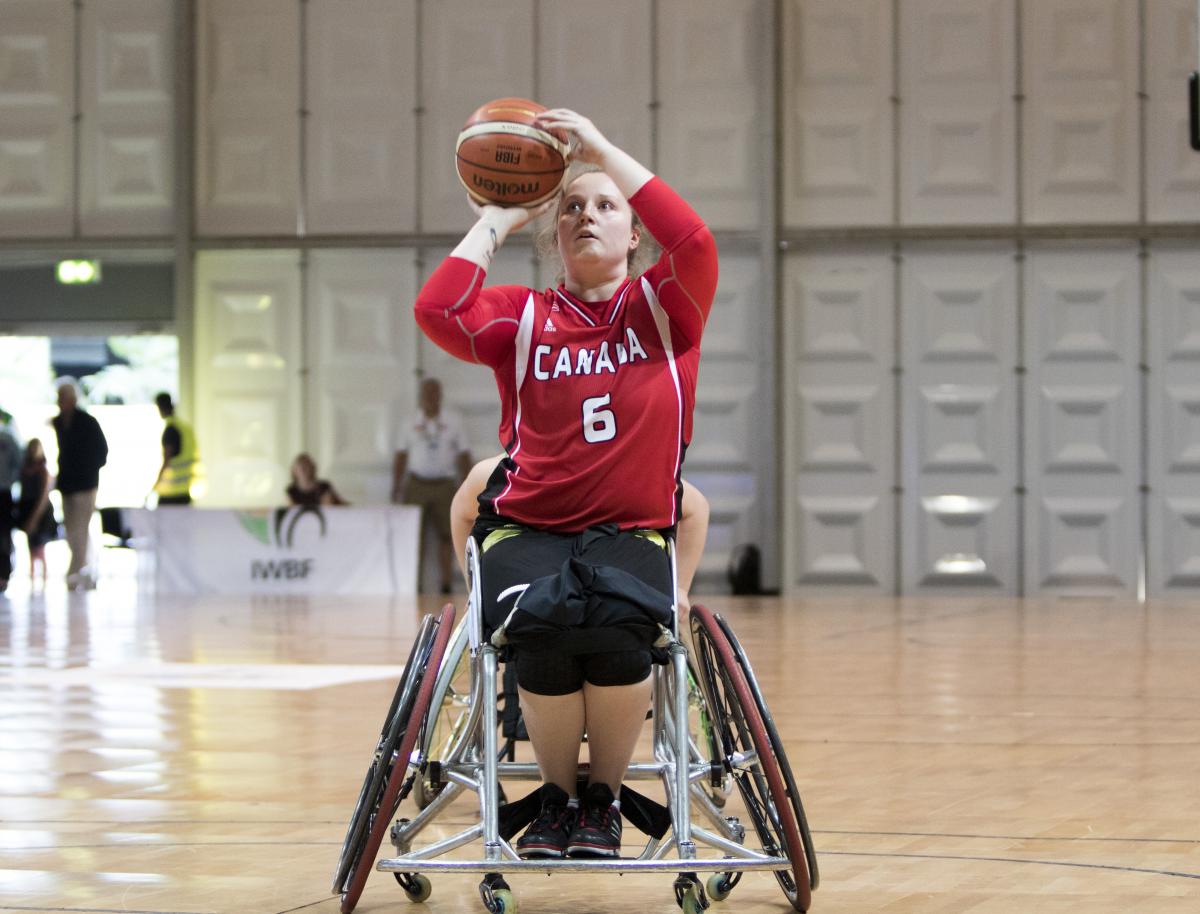 female wheelchair basketballer Arinn Young prepares to take a shot