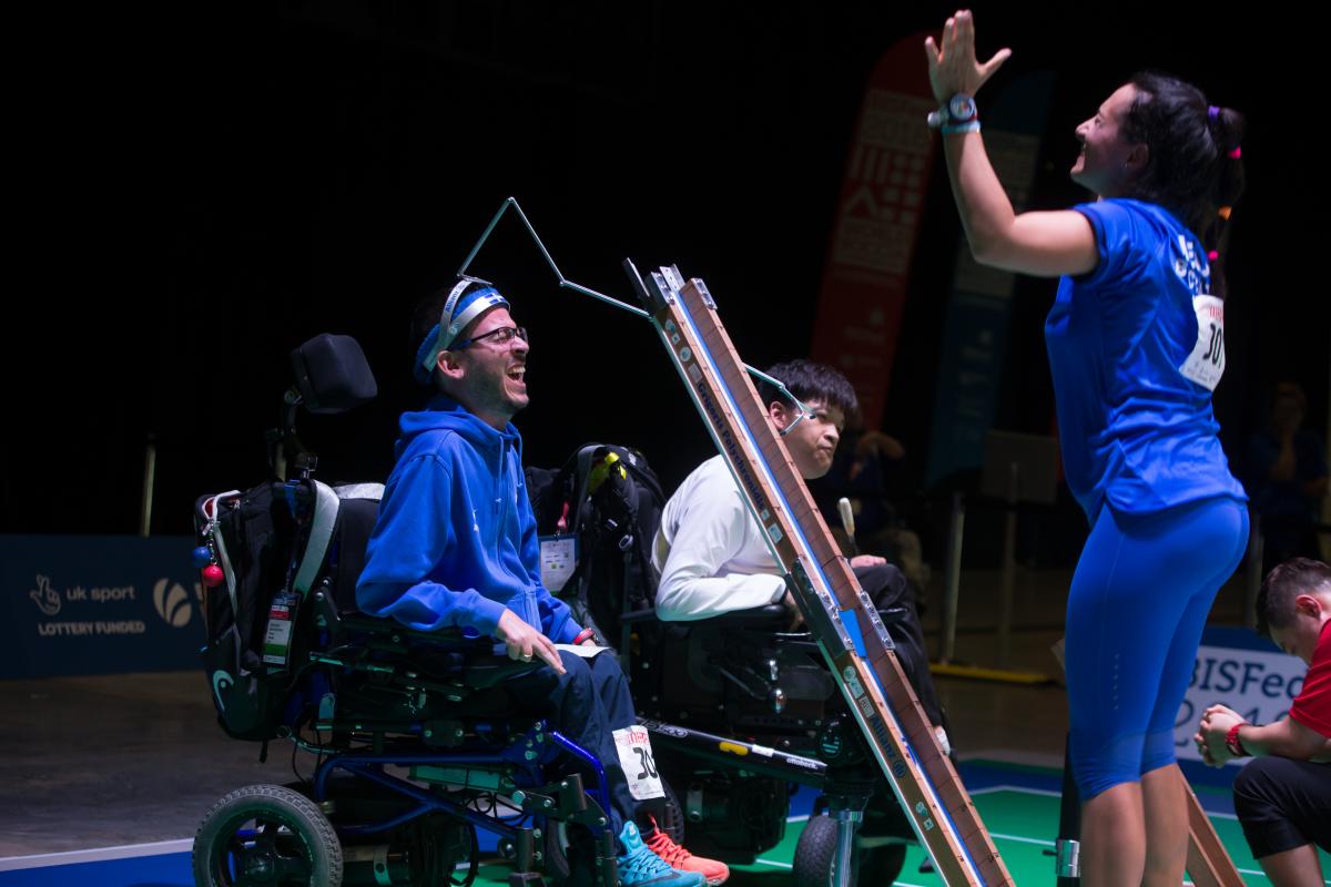 male boccia player Greg Polychronidis celebrates his winning ball