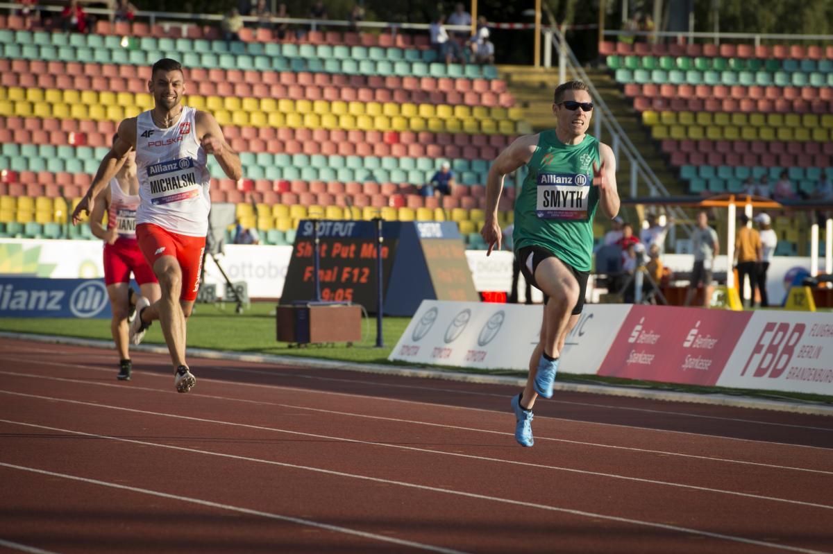 male vision impaired sprinter Jason Smyth runs towards the finish line