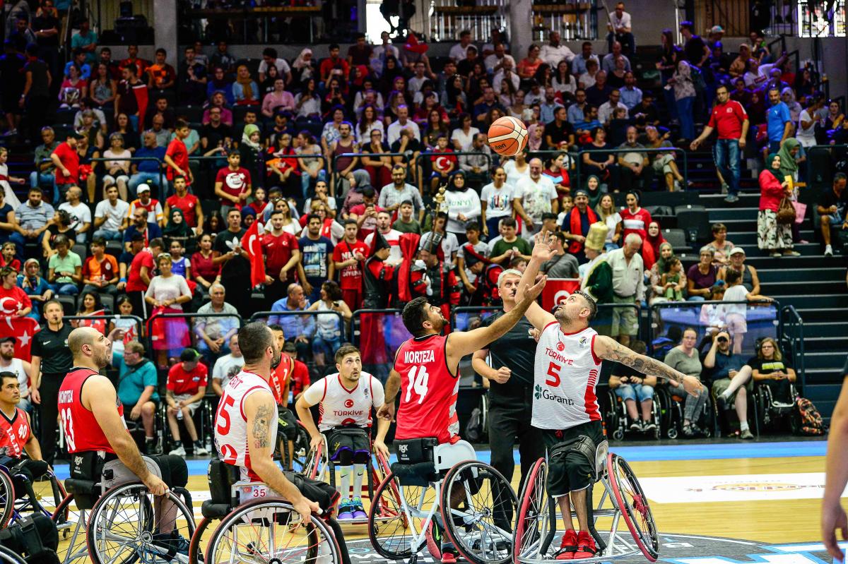 Male wheelchair basketballers Morteza Ebrahimi and Ozgur Gurbulak fight for the ball