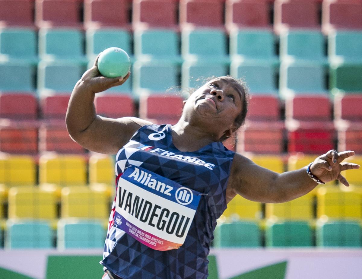 female Para athlete Rose Vandegou prepares to throw the shot put