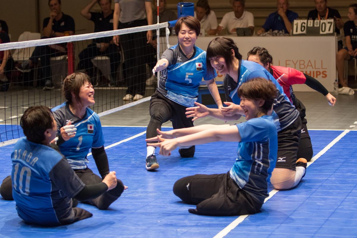 female Japanese sitting volleyball players play the ball