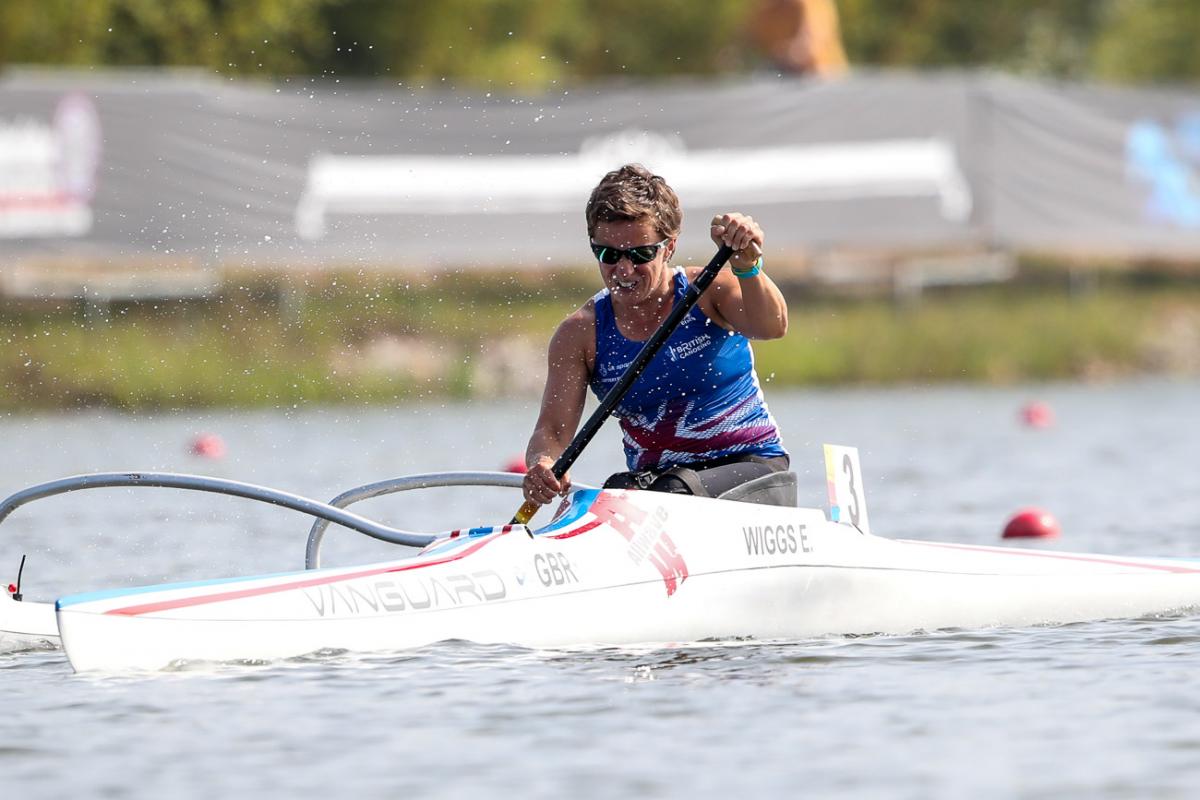 female Para canoeist Emma Wiggs performing a stroke