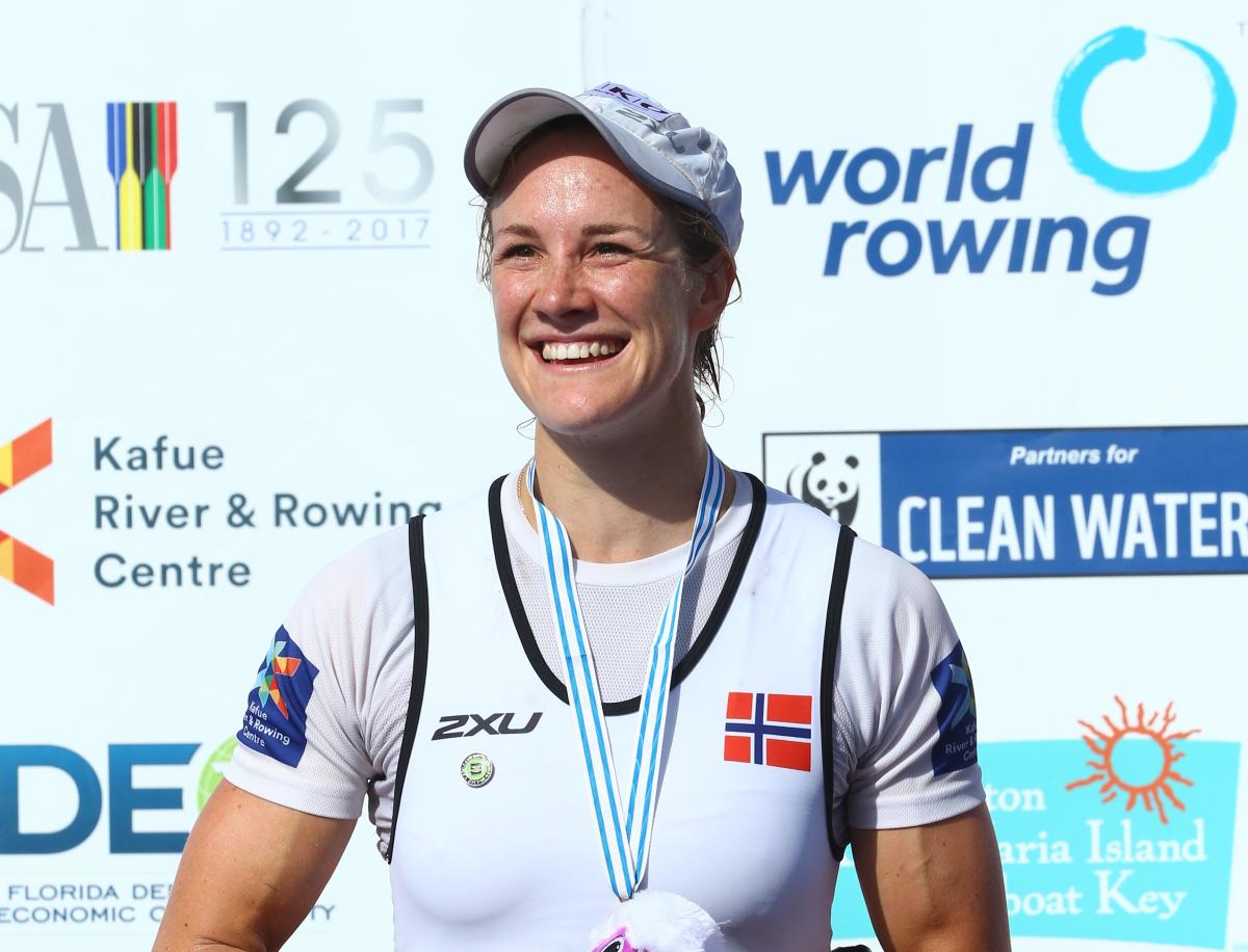 Birgit Skarstein female Para rower Birgit Skarstein smiling with her medal on the podium