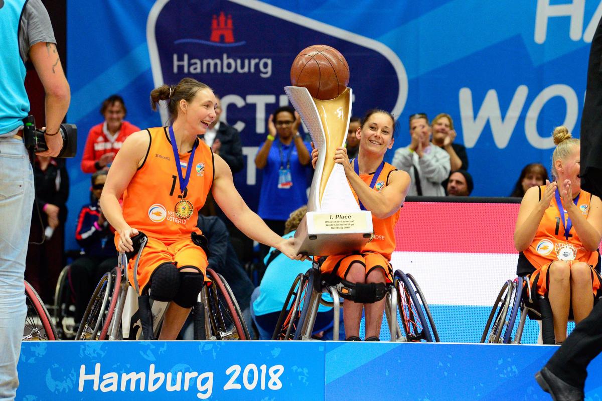Carina de Rooij - Hamburg 2018 female wheelchair basketballer Carina de Rooij lifts up the trophy