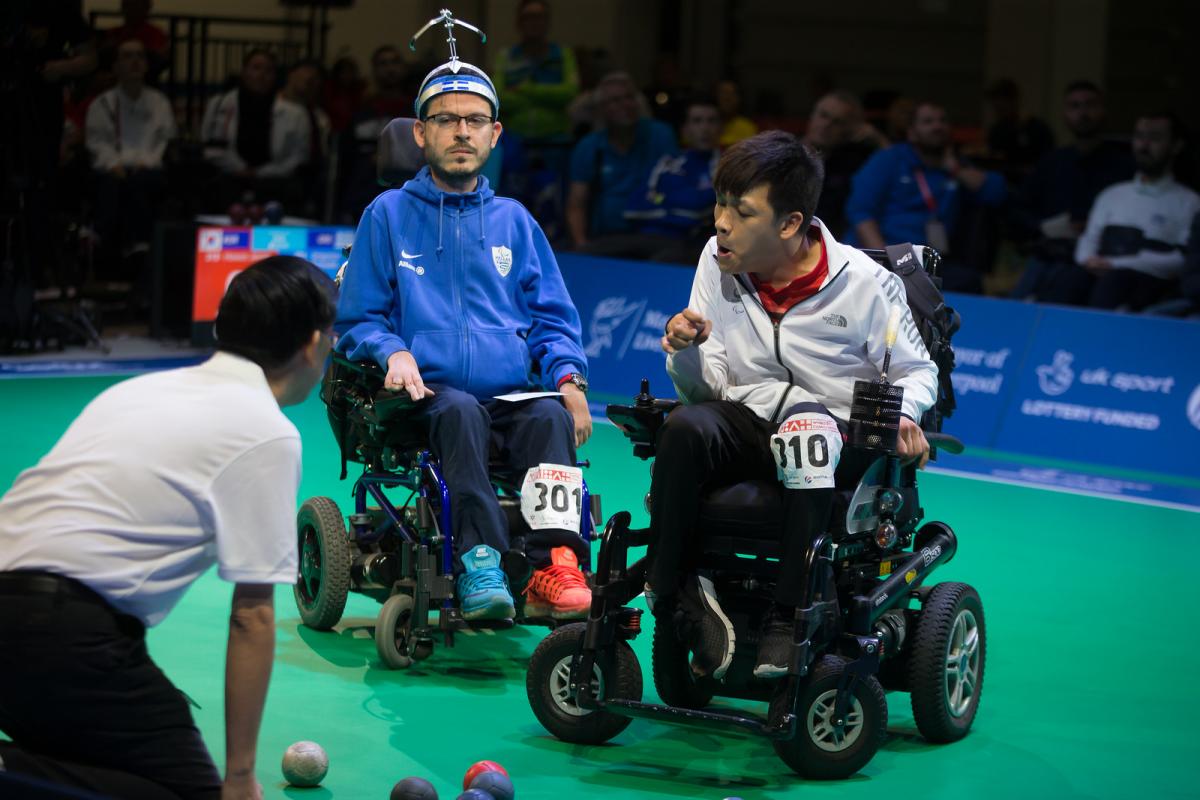 male boccia players Greg Polychronidis and Howon Jeong prepare to play