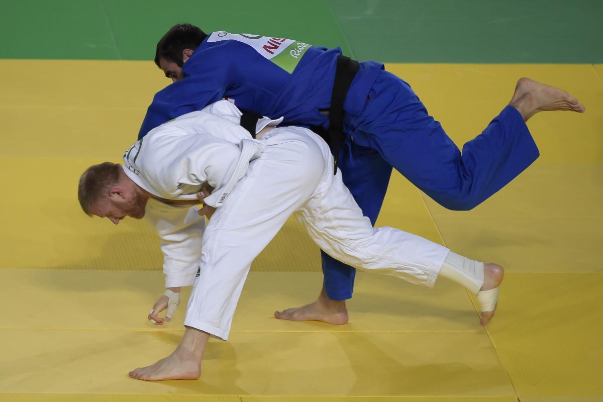 Georgia's Zviad Gogotchuri battles with Ukraine's Oleksandr Nazarenko during the men's -90kg judo gold medal match at the Rio 2016 Paralympic Games.