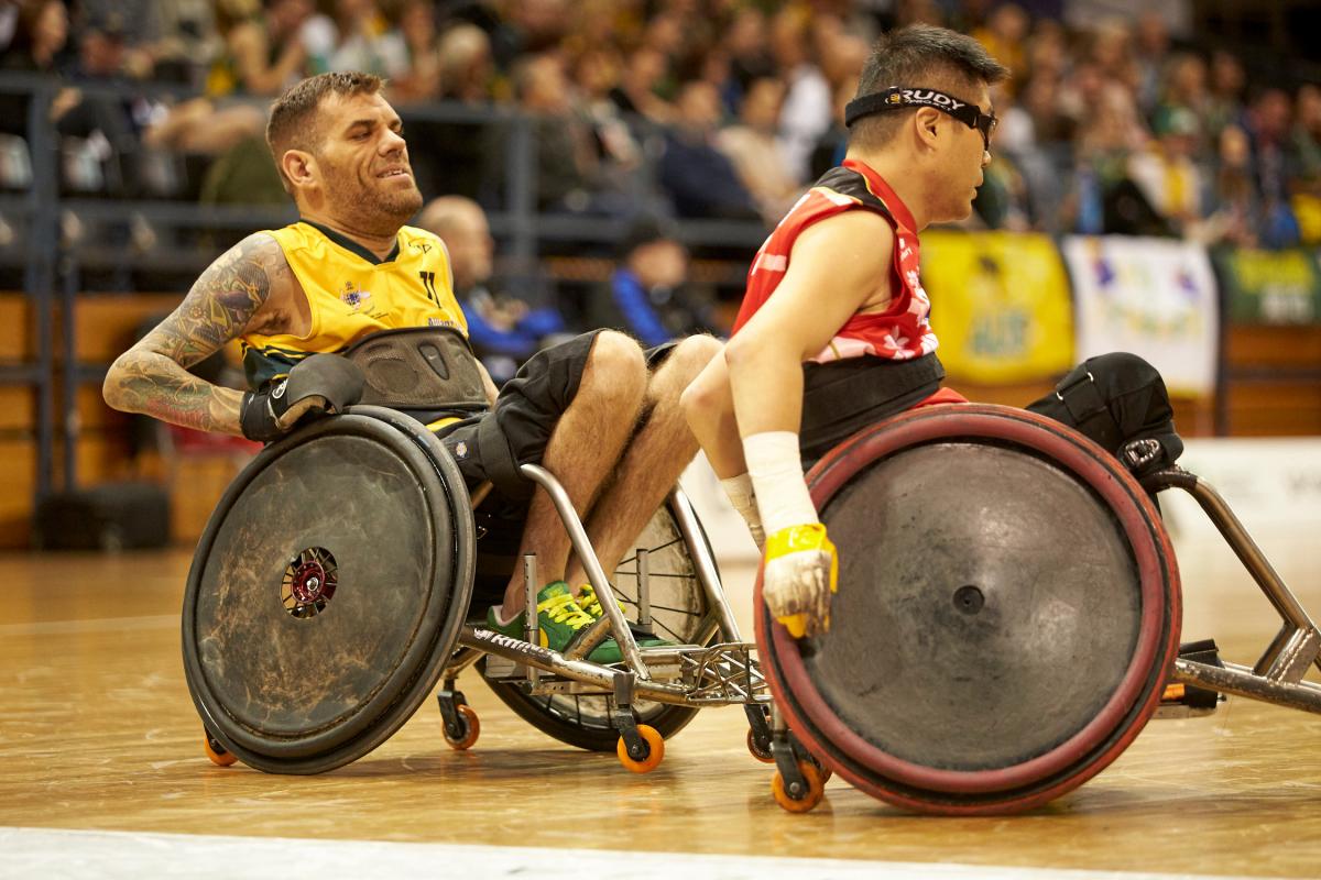 Ryan Scott - Sydney 2018 male wheelchair rugby player Ryan Scott chases another player with the ball