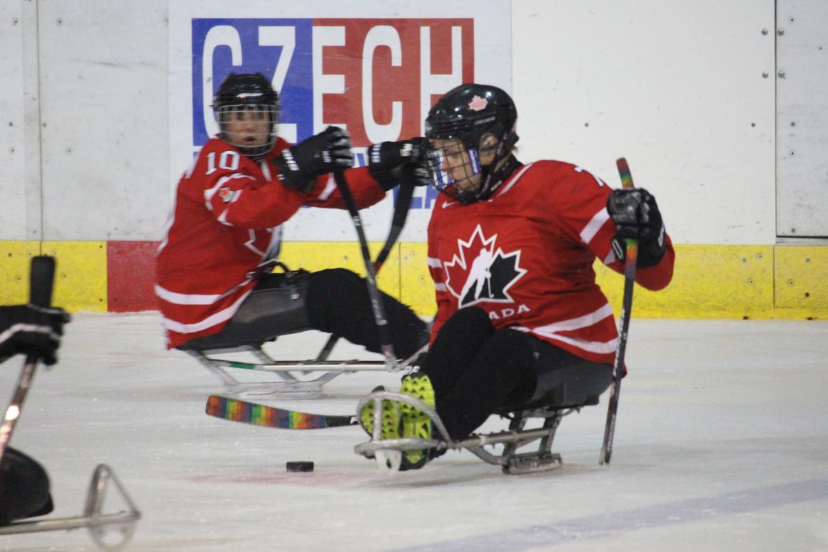 two female Canadian Para ice hockey players on the ice