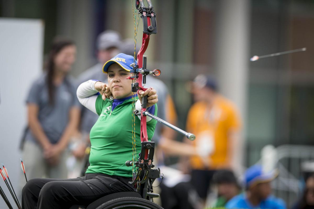 female Para archer Jane Gogel pulls back an arrow ready to shoot