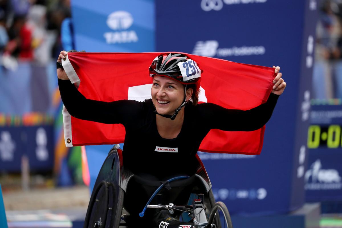 Manuela Schaer female wheelchair racer Manuela Schaer holds up the Swiss flag