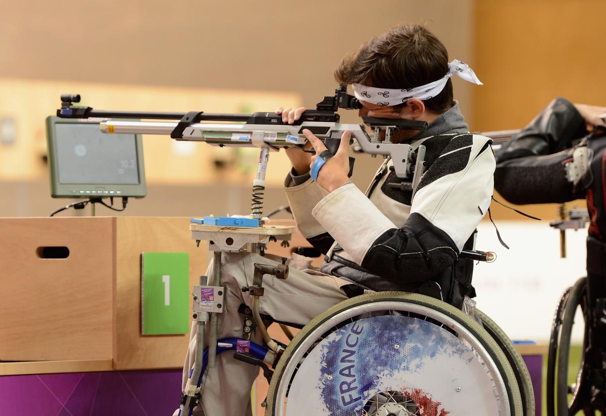 Shooting Para sport - Tanguy De La Forest - France - London 2012 Man in a wheelchair shooting a rifle
