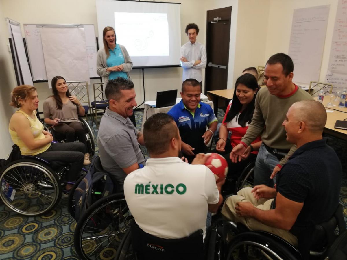 A group of people in a meeting room