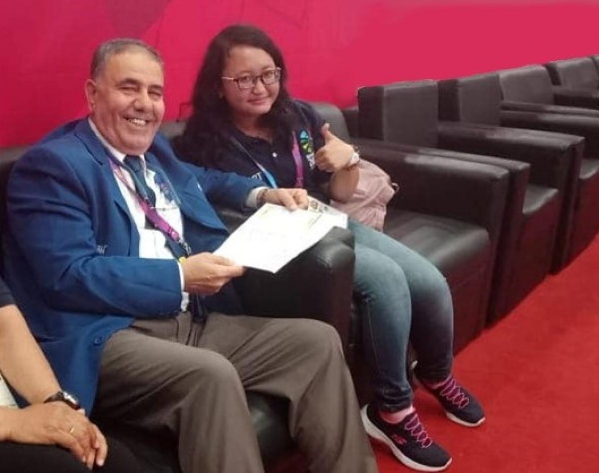 Meytha Sarasvati - Indonesia 2018 female powerlifting official Meytha Sarasvati gives a thumbs up to the camera