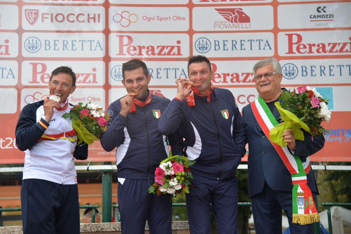 Francesco Nespeca - Lonato 2018 three male Para shooters with Francesco Nespeca in the middle, biting their medals