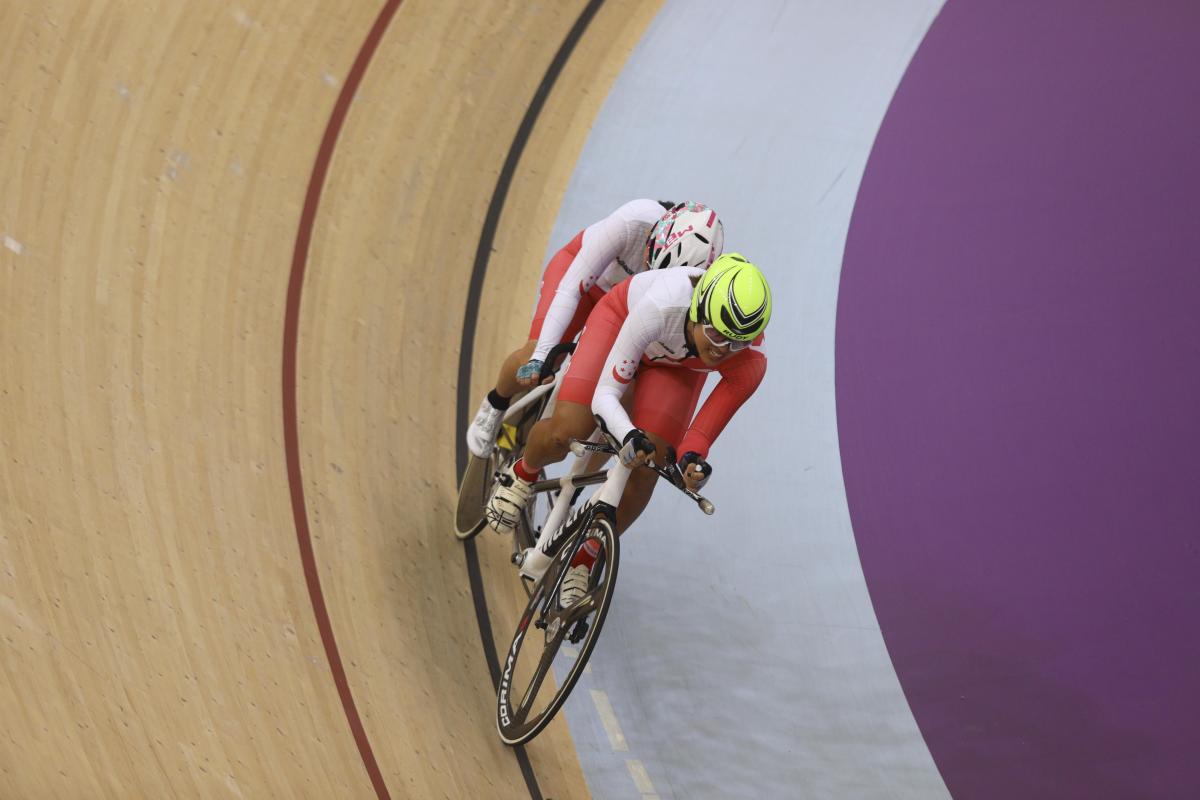 Emily Lee - Indonesia 2018 female Para cyclist Emily Lee goes round the track on a tandem cycle