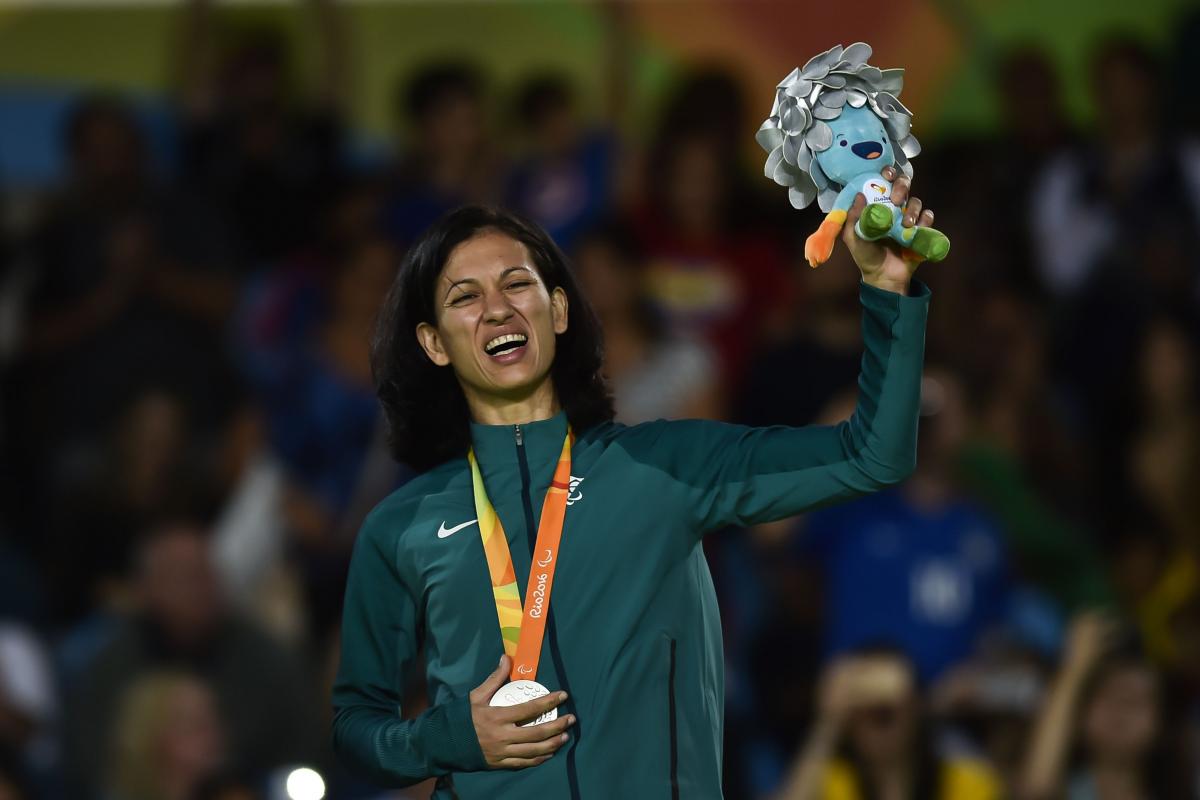 Lucia Araujo - Rio 2016 female judoka Lucia Araujo smiles on the podium holding up a mascot