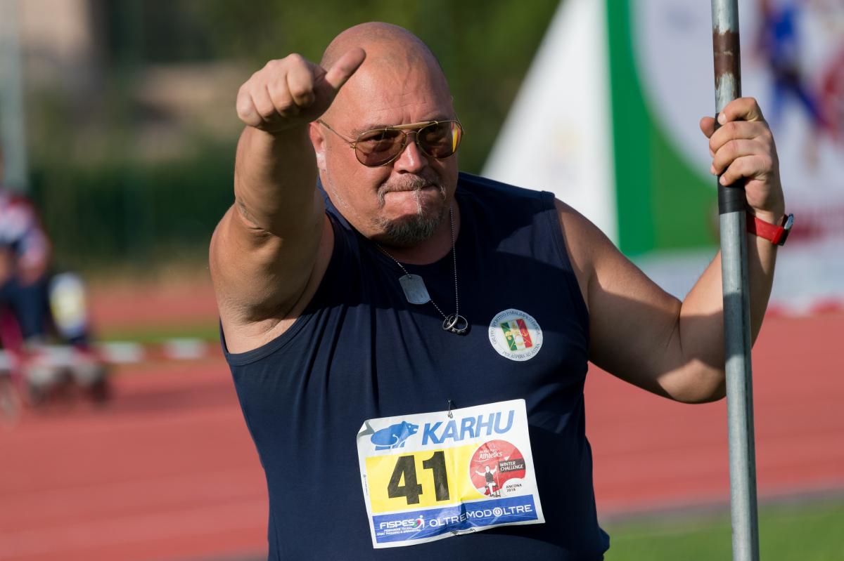Giuseppe Campoccio holding the javelin