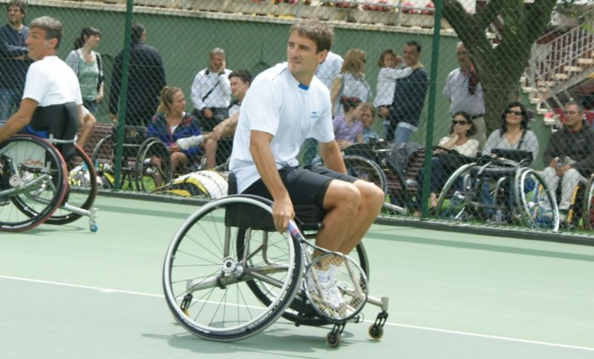 Tommy Robredo plays wheelchair tennis male tennis player Tommy Robredo in a wheelchair on the court