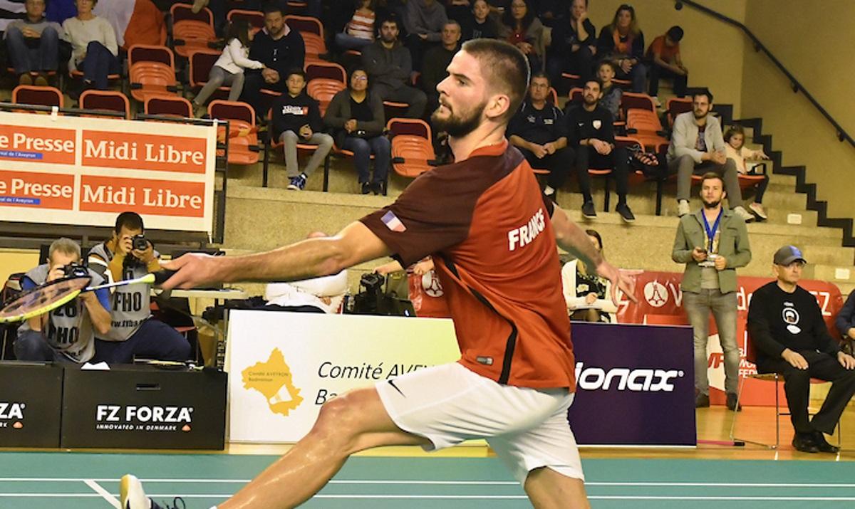 male Para badminton player Lucas Mazur plays a backhand