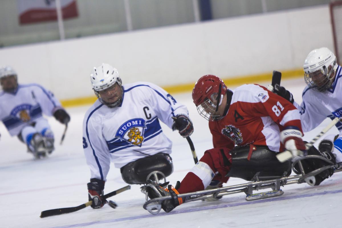 Markku Hirvela - Finland - Para ice hockey male Para ice hockey player Markku Hirvela defends the puck from a Polish player