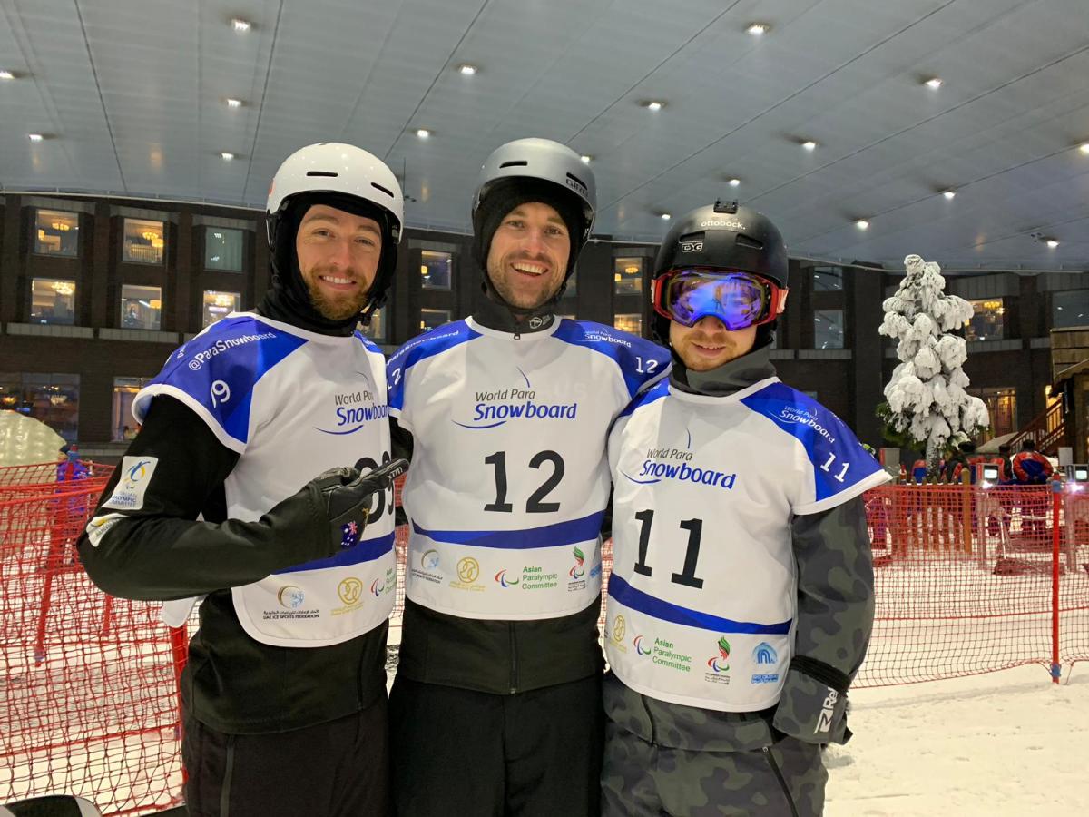 Dubai 2018 World Cup - Para Snowboard - Australia's Simon Patmore and Sean Pollard and Austria's Patrick Mayrhofer Three men with helmets in an indoor ski resort