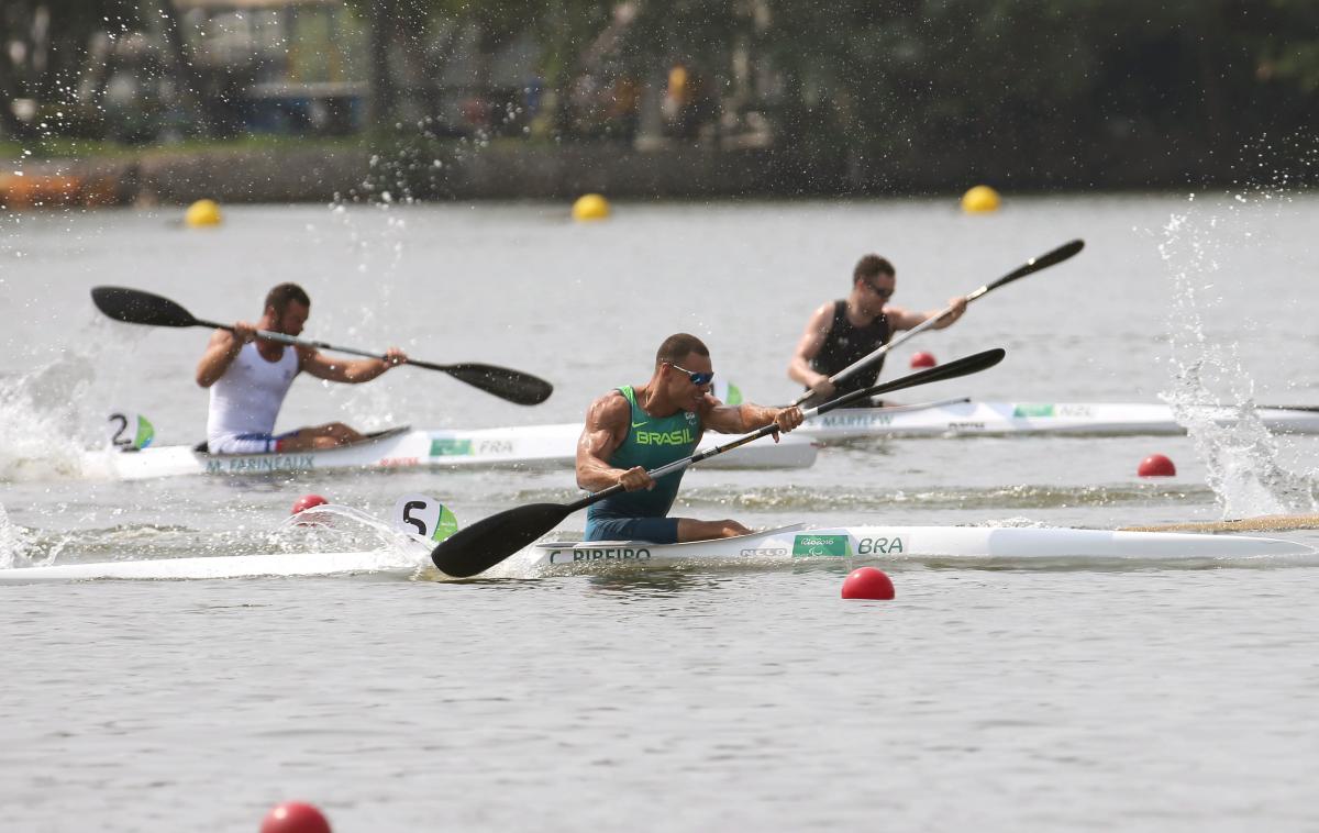 Caio Carvalho male Para canoeist Caio Carvalho mid-stroke during a race on the water