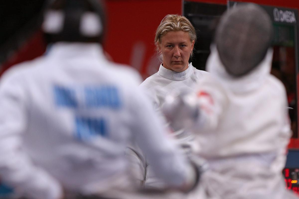 female wheelchair fencer Zsuzsanna Krajnyak with her guard off on the piste