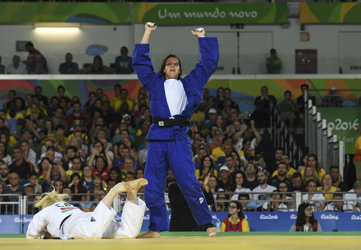 Naomi Soazo - Rio 2016 female judoka Naomi Soazo raises her arms straight up in the air in celebration